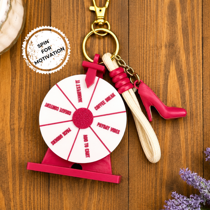 Keychain with spinning wheel and high-heeled shoe on a wooden surface